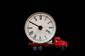 Clock on a red flatbed truck