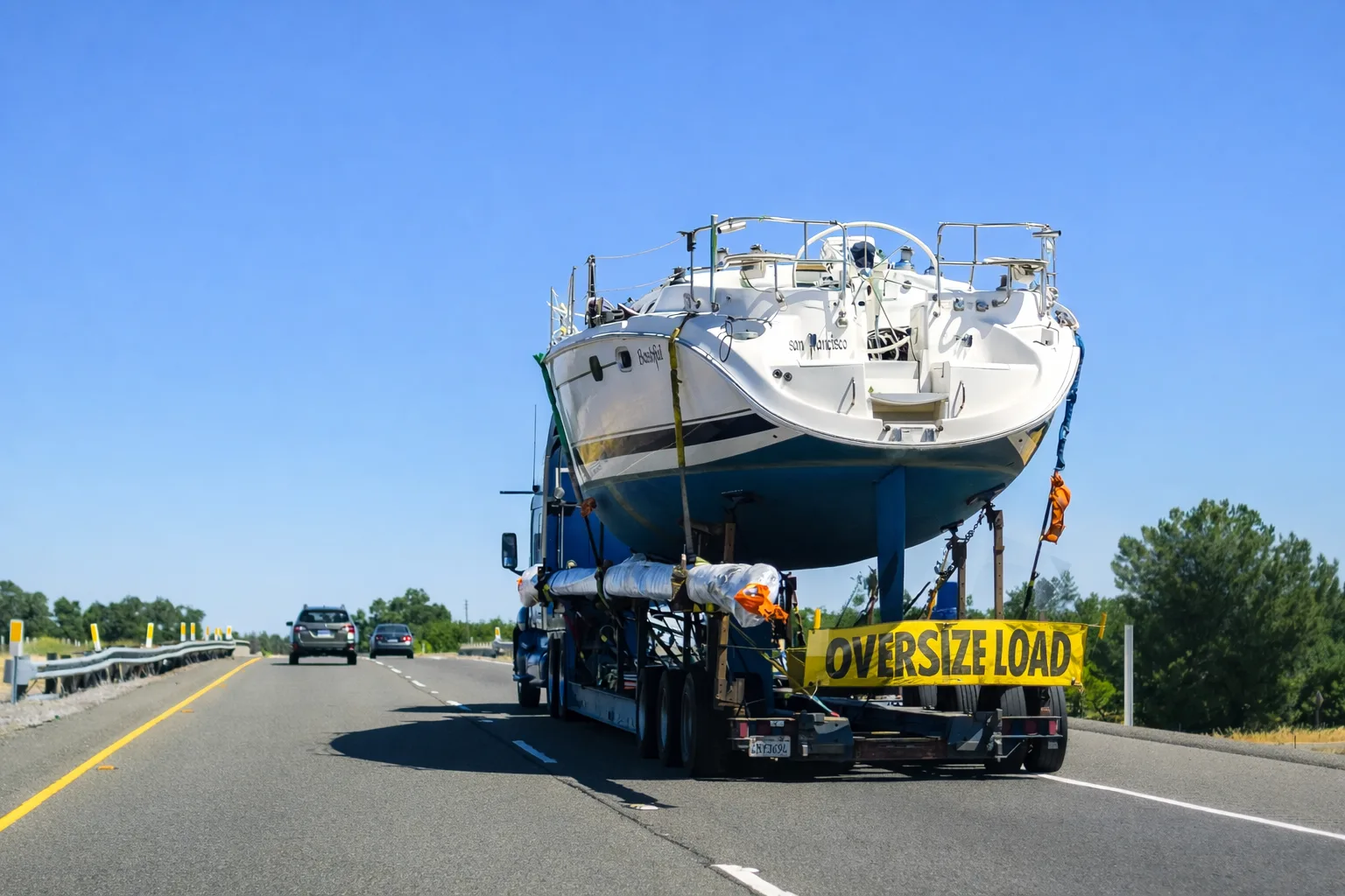 Large Boat Transportation on an Open Trailer